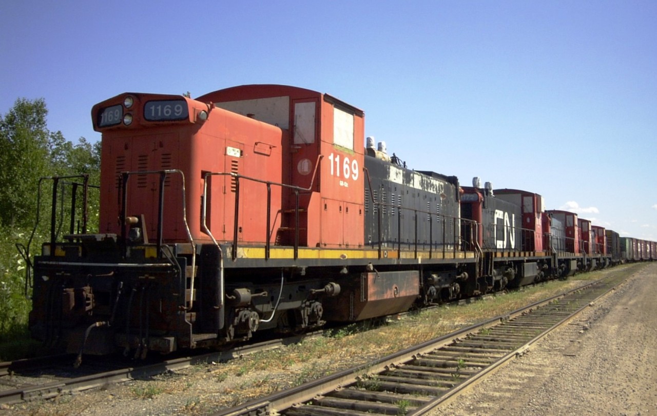 Except for the plywood on the windows and the wrapped exhaust stacks, this dead train looks like any other branchline movement. Made up of five ex-CN GMD-1 locomotives and a long string of flat and box cars, this train to nowhere sits in ONR's North Bay yard waiting for someone to come along and lease each unit for another chance at a second, or third, or fourth life.
