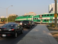 The second of the two westbound GO trains from Toronto eases across King Street into the track where the train sits until its next departure to Toronto.