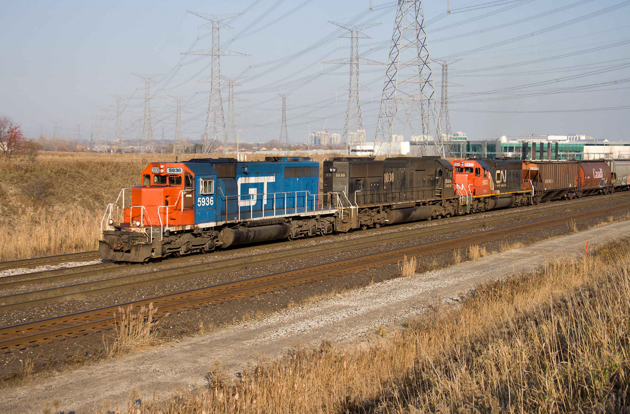 A blast from the past!  GTW 5936, IC 1030 and GTW 5933 ease Capreol-Toronto #596 up to Snider before entering MacMillan Yard.  GTW 5936 is the last SD40-2 to wear Grand Trunk blue and made for a nice surprise on a beautiful saturday in November.