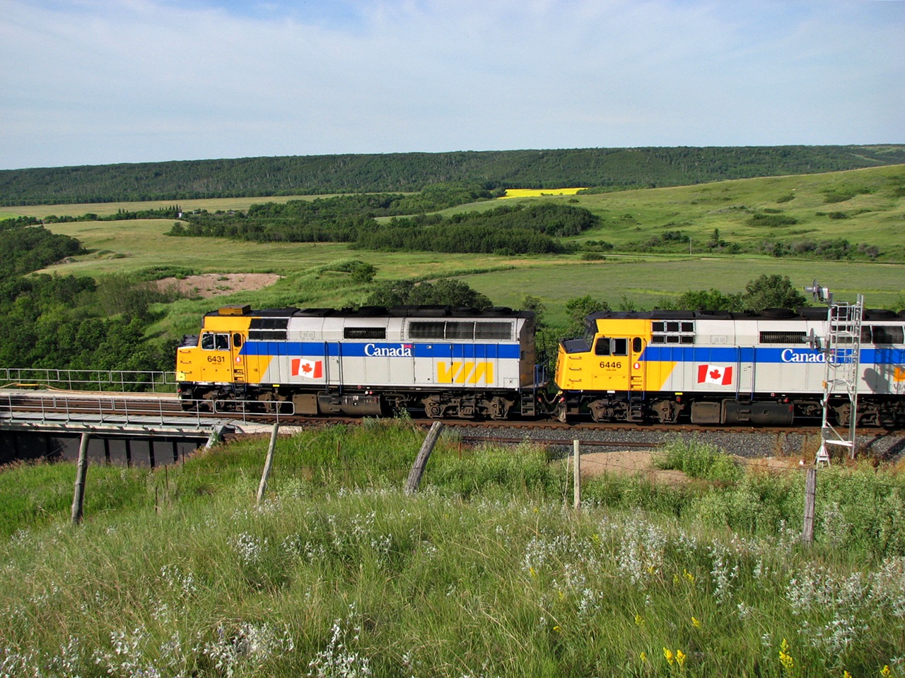 Early Morning eastbound Canadian at Uno Manitoba with F40PH-2's leading the way are making there way along the Assiniboine Valley as they are about go across the trestle. A scene like this due to the units been rebuilt and schedule changes to Via Rail passenger service is no longer possible.