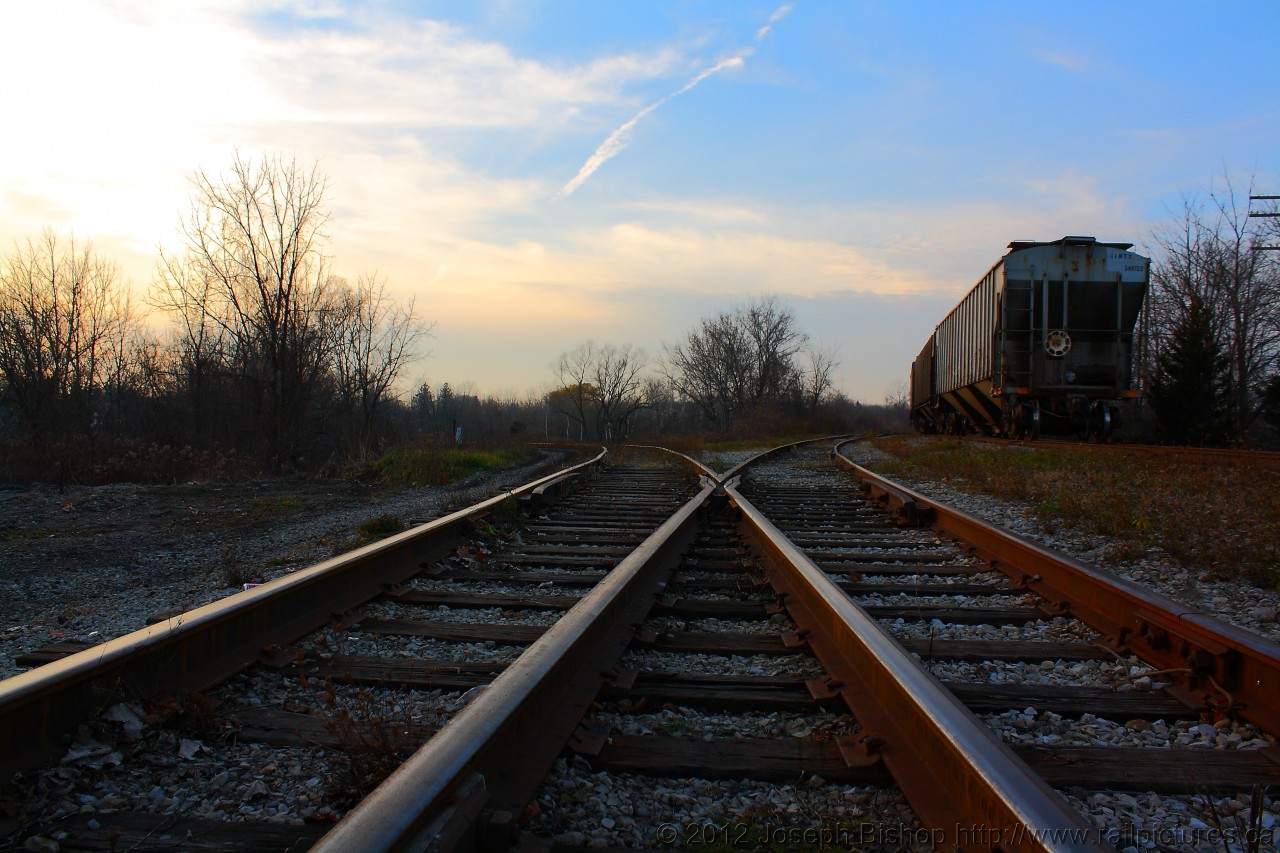 While waiting for RLK 4057 to appear at Caledonia, I took the opportunity to do some creative photography.  Dusk was approaching and the sun was providing some good light so I used the track to my advantage.  The track to the left leads to Hagersville and the track to the right goes to Brantford.