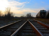 While waiting for RLK 4057 to appear at Caledonia, I took the opportunity to do some creative photography.  Dusk was approaching and the sun was providing some good light so I used the track to my advantage.  The track to the left leads to Hagersville and the track to the right goes to Brantford.