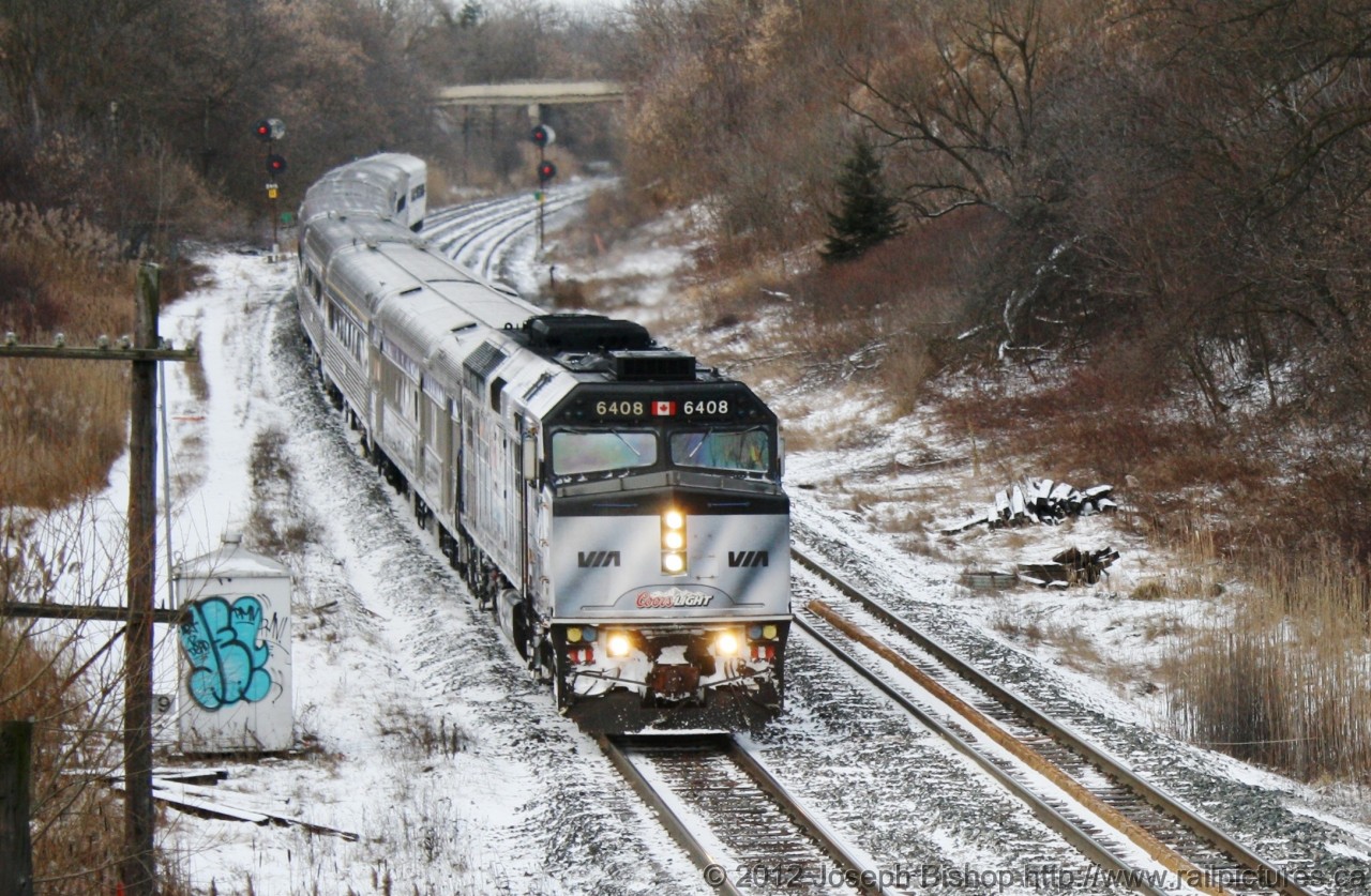 The Silver Bullet streaks through Copetown Ontario on a frigid morning in early January.  This is the first and last time that I would see this unit in the Coors wrap, shortly after this photo Via 6048 was sent to CAD for repainting.