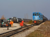 Good fortune was with me this morning, a MOW crew had to be called to do some work on the main yard switch at Garnet which caused the crew of SOR 598 to not be able to start work until they were done fixing the switch.  Here we can see SOR 598 waiting patiently on the main and the two workers discussing their options for the work.  