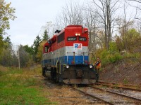 The conductor on RLK 4057 looks back at me as he rides the rear of his locomotive.  He will have to throw the switch up ahead to run his locomotive back up the wye to collect his train.