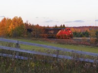 CN 2431, IC 1005, 1034 are in charge of X316 south, seen at Warden Ave, mile 33 of the CN Bala Sub in the last few minutes of sunlight. — 