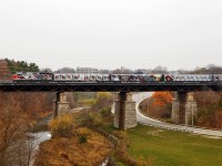 The Canadian Football League's Grey Cup tour train speeds westbound, flying over 16 Mile creek in Oakville. It is dead-heading to Hamilton Yard for public display on Saturday November 10th.