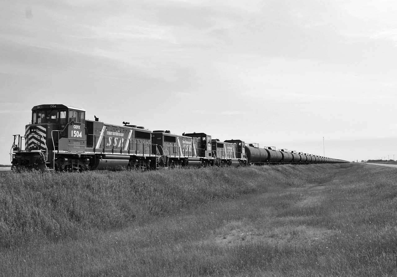 CEFX 1504 and its two sisters wait for the last half a dozen cars or so to be loaded at the Cresson Point oil loading facility at Stoughton. There was 82 cars of oil from what I am told you multiply that by 2 and that is how many trucks have been taken off the road on one trip.