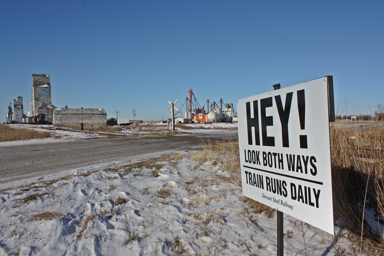HEY !!!! Blair Stewart and his railway are finding different ways to prevent grade crossing accidents as they have posted signs like this and others with similar message after every crossing on the subdivision.