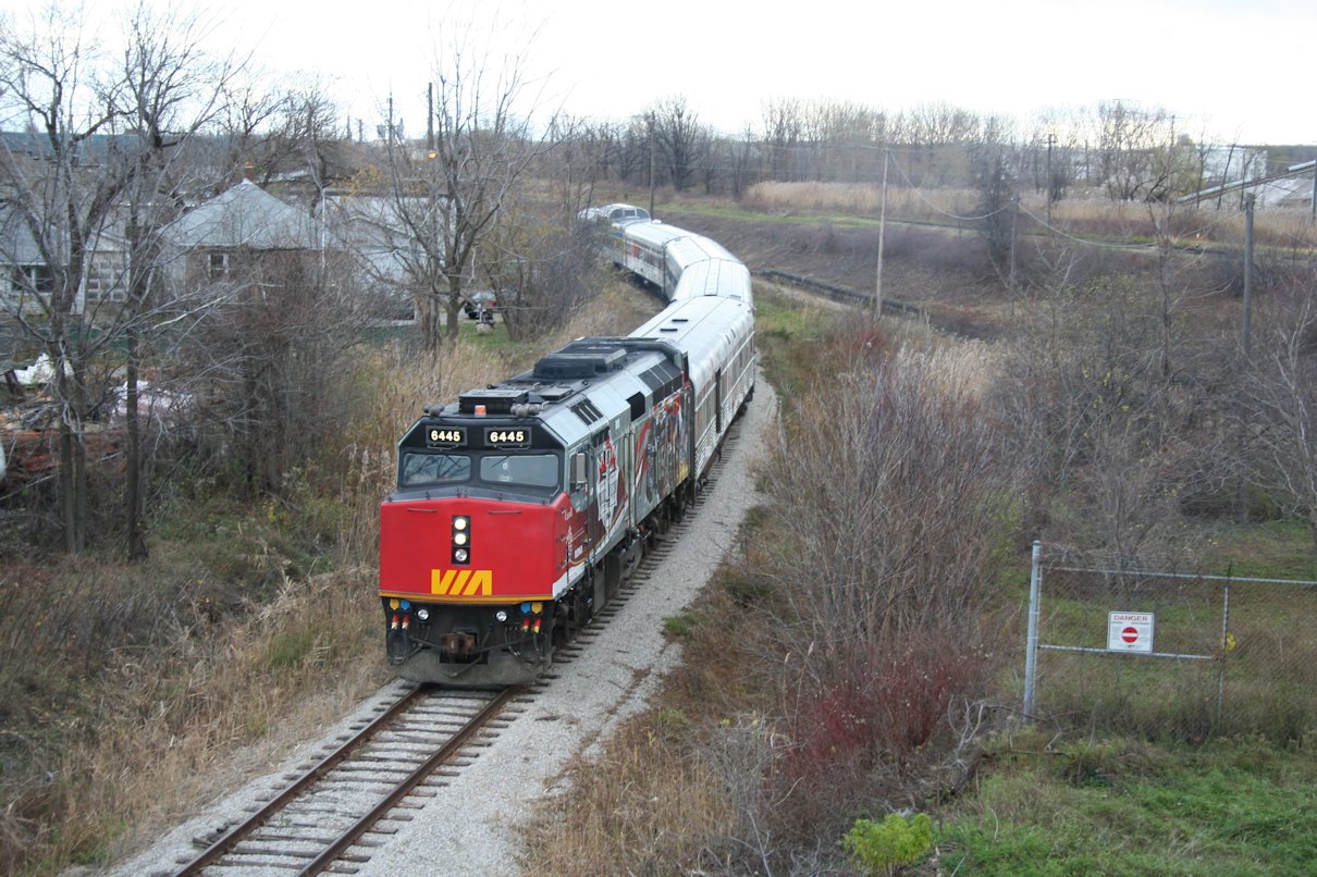 The CFL Centennial Train backs down the Point Edward spur on the way back to CN's Sarnia yard. While VIA trains regularly used the first part of the Point Edward Spur as a lead to cross over the main and access the wye, this is the first time in decades, if not even a century, that any passenger train has come this far. No passenger train will have ever been shot on this curve from this bridge before, and likely never will be again.