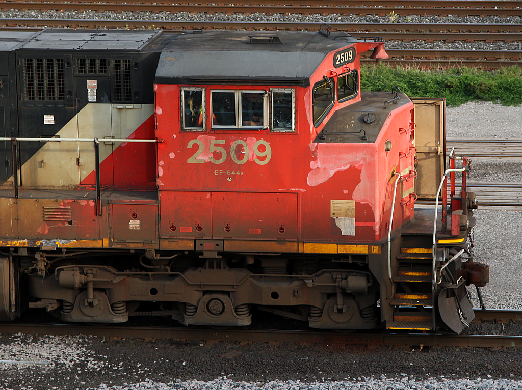 Distinctly Canadian. Being the pioneer to the now standard "comfort cabs", CN had their first order of C44-9Ws be equipped with their "Canadian Cab" design with notable features such as a four piece windshield and a high mounted bell.