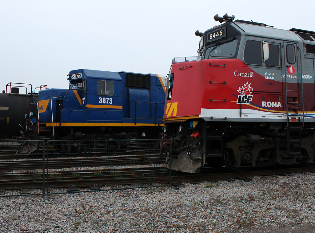 RLK 3873 goes about it's work while 6445 watches on.