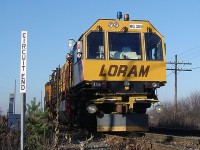 The LORAM Railgrinder sits on the siding at Kleinburg at the circuit end sign, awaiting a meet between CP #101 (northbound) and #222 (southbound) before grinding south on the MacTier Subdivision.