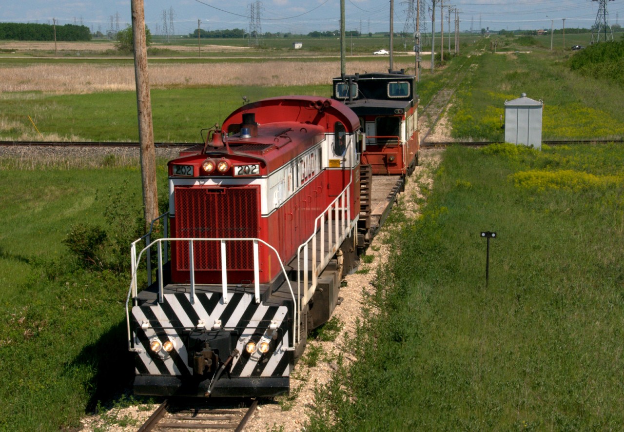 GWWD 202 MLW RS-23 leads a small work train back into Winnipeg.  The train originated at Indian Bay and has just crossed the CN's Namisco spur