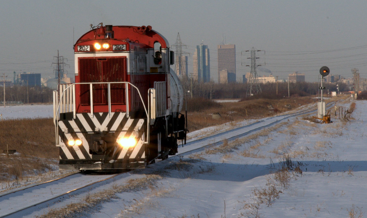 GWWD RS-23 202 with one tank car, heads out of Winnipeg MB to the water treatment plant at Deacon, on the outskirts of the city.