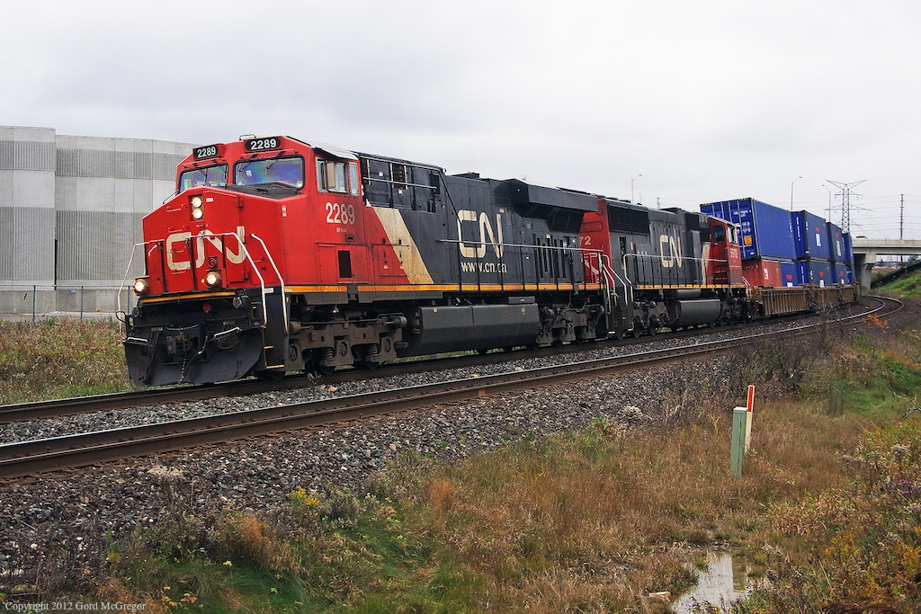 After being ordered to Mac Yard for an Oshawa bound auto rack cut 106 takes the main approaching Hagerman's and a meet with 369.
