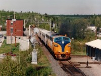 Mid-morning southbound ONR #122 with 2001,205 for power accelerates out of Swastika, Ont. The leader is the former 1509 and was retired 2004, scrapped 2008.