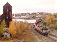 On a rather dull afternoon it was a treat to catch ONR 1731, 1735 and 1736 with a northbound freight thru Cobalt, Ont. The sun normally would have been seen dead centerin the sky at this time of day, so it turns out 'dull' was a bonus. The Cobalt station can be seen behind the end of  train. Leader and trailing unit were sold to Progress Rail in 2005. The 1735 remains on ONR roster.