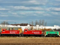 OSR 1244 and 1249, ex CP SW1200's with the van in tow are switching the CAMI Automotive plant in Ingersoll Ontario