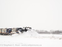 <b>Plow Extra:</b> During the Winter of 2007, strong relentless winds (Which cause drifts up to 3-4M high) and a couple months of white stuff on the ground caused the ordering of a rare Plow Extra on the Goderich subdivision. During the CN years, this line was well known to host a pair of F units in plow service and was frequented by photographers. With Goderich and Exeter having had recently transferred two covered wagons of their own from Lakeland and Waterways, the ingredients were ripe for a repeat of the covered wagon plow extra!<br><br>
Plow extras such as this are becoming harder to find, mostly due to costs - it takes four crew members to operate a plow train: Two MOW employees in the Plow to operate left and right side appliances and horn - one of these will also radio instructions to/from the Conductor and Engineer themselves whom reside in the tail end engine managing progress over the road and train speed. In addition, the beating a plow takes requires constant maintenance in order to keep it operating - in summary a whole lot of money is spent to run these trains and a resultant amount of snow is required in order to call them.<br><br>
A photo is best used to summarize, and in this scene, 1938 built GEXR 55413 (ex CN 55413), GP9 RLK 4001, F9A RLK 1400 and F9A RLK 1401 have found a small drift of snow and are busting it in the farmlands near Mitchell, Ontario.<br><br>

