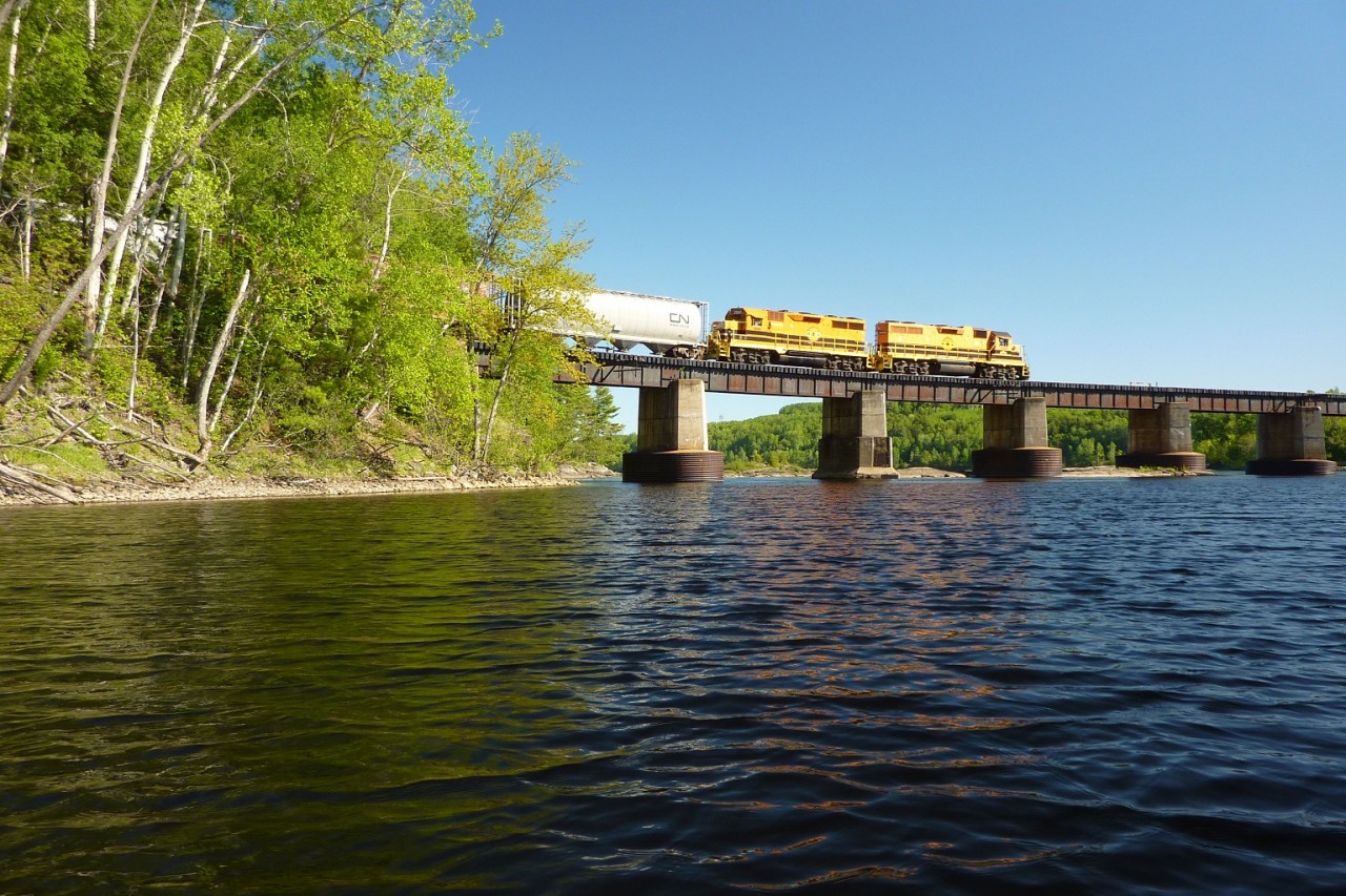 Southbound QGRY train crossing bridge over the St. Maurice River between Shawinigan and Trois-Rivières, Québec.