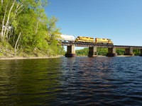 Southbound QGRY train crossing bridge over the St. Maurice River between Shawinigan and Trois-Rivières, Québec.