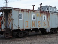 QNS&L 64 is due for a little primer and paint as evidenced by this November 13, 2007 photo.  The double exhaust stacked caboose was sitting on the van track at the car shop in Sept-Iles on this dreary and overcast day.