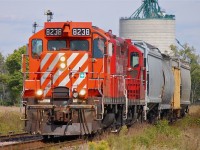 CP T76 departing Kent Bridge Ontario after setting off some hoppers at the grain elevator with two GP9u's leading.