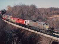 Quite the combination of power on this afternoon's TH&B "Starlite" with QNSL 209, CP 8921 and TH&B 77 seen here on approach to Bayview Jct. The Starlite was a daily late afternoon/early evening run between Toronto and Hamilton (and return) over the CN, and was a favourite of the railfan crowd.