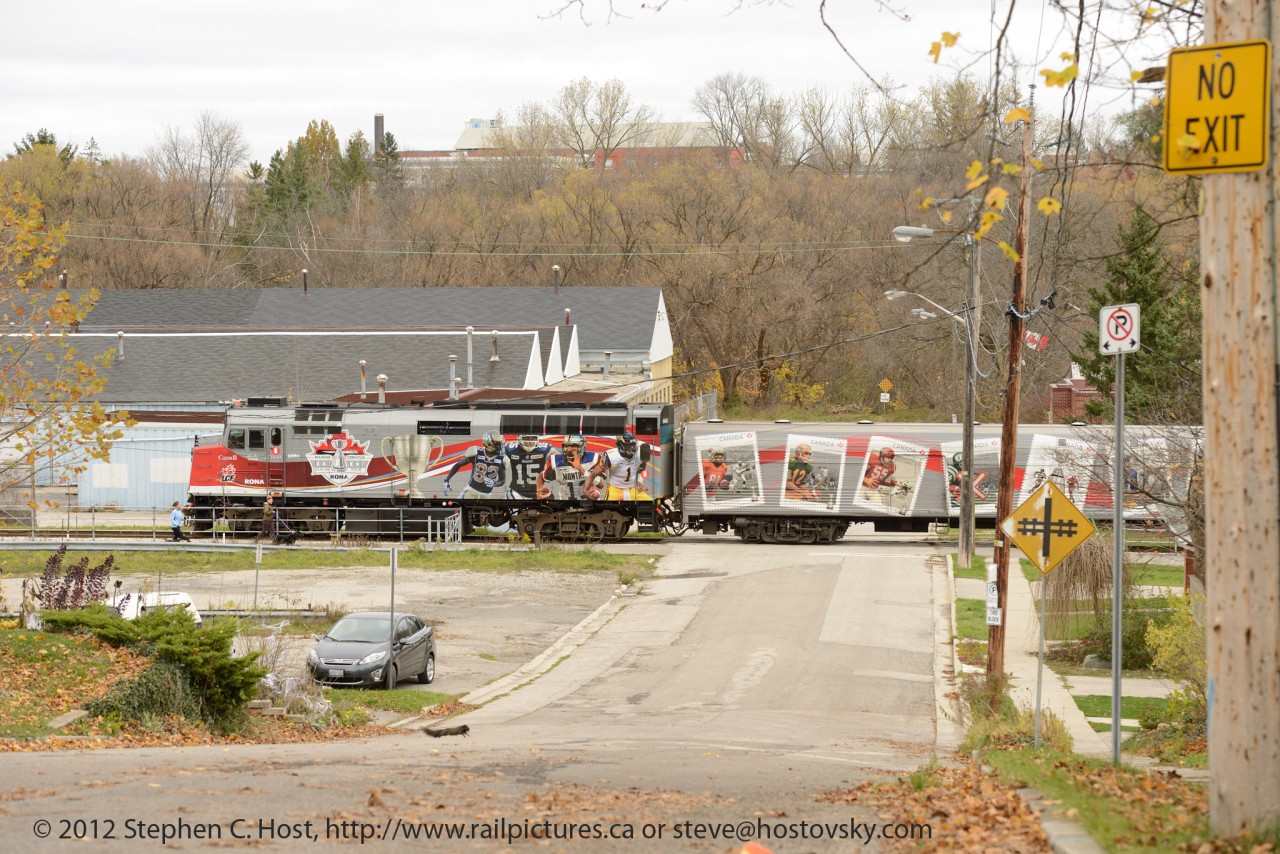 VIA 6445 is heading towards downtown Guelph with the CFL Grey Cup Train past Armco's oldest remaining Guelph plant. This section of Guelph once had two rail lines, Guelph Junction Railway (pictured) and a CN Line (Formerly Great Western Railway) - the CN line abandoned in the mid 70's.