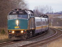 6451 bites the S curve at Nichols road. Seen in the background is CN M30831 04's freight, who would pass by seconds after the J train.