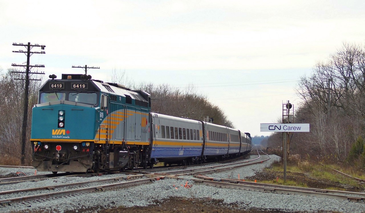 VIA 73 with VIA 6413 leading and VIA 6419 trailing rolls across the new high speed diamond at Carew in Woodstock Ont.