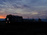 An eastbound Via train briefly disturbs the tranquility of dusk just outside of Newcastle, Ontario. 1711hrs.