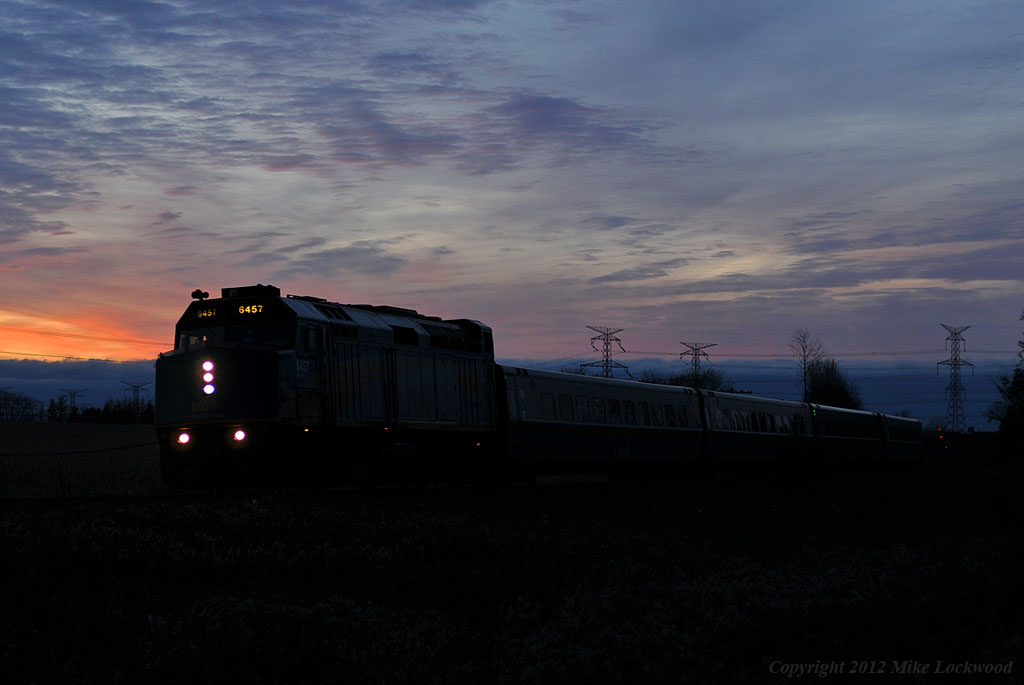 An eastbound Via train briefly disturbs the tranquility of dusk just outside of Newcastle, Ontario. 1711hrs.
