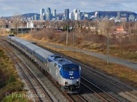 On a cold November morning, Amtrak Adirondack with leased VIA Rail stainless steel equipment, has just left the Island of Montreal as it rolls on the south shore at St-Lambert 

