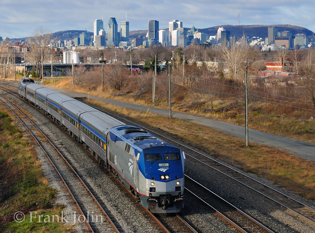On a cold November morning, Amtrak Adirondack with leased VIA Rail stainless steel equipment, has just left the Island of Montreal as it rolls on the south shore at St-Lambert