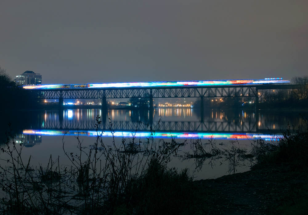 After a stop at the old Galt Station a few minutes prior, Canadian Pacific's US Holiday Train pulls onto the Grand River Bridge for points west, next stop Ayr, Ontario.
