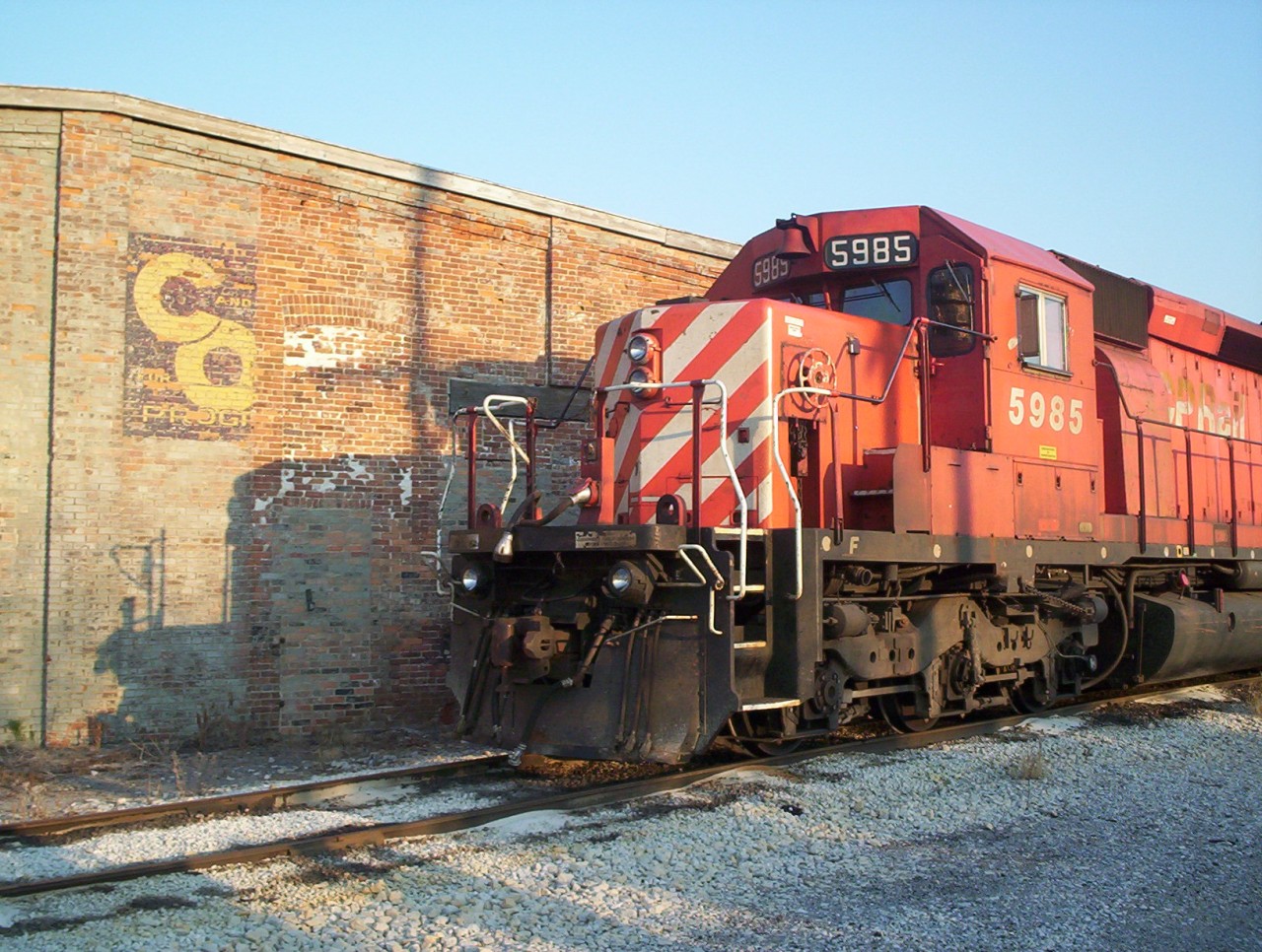 Canadian Pacific power rests for the evening at CSX Sarnia after powering the daily CSX sarnia-chatham interchange run. CSX traffic was handled with a pair of CP units and canadian CSX crews, this train is no longer in operation. As an added bonus tonight the CP units are parked besdie the CSX engine house at Sarnia wich still sports is C&O "for progress" logo on the brickwork.