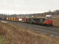 On a dreary Christmas Eve CN 2135 and IC 1021 scream through Snake after sitting at Bayview for close to 45 minutes waiting on VIA 97 and CN 421. 