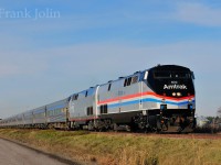 Bound for Albany N.Y, Amtrak Special move with two leased VIA Rail Stainless Steel train sets is seen rolling south at L'Acadie Quebec.