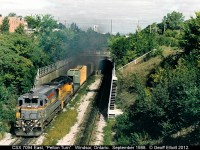 The CSX "Pelton Turn" roars out of the old Canada Southern railway tunnel after having passed under the Detroit river on it's way from Rougmere Yard in Dearborn, Michiga to Windsor, Ontario to interchange with CN and drop/lift cars for local CSX operations in Canada.