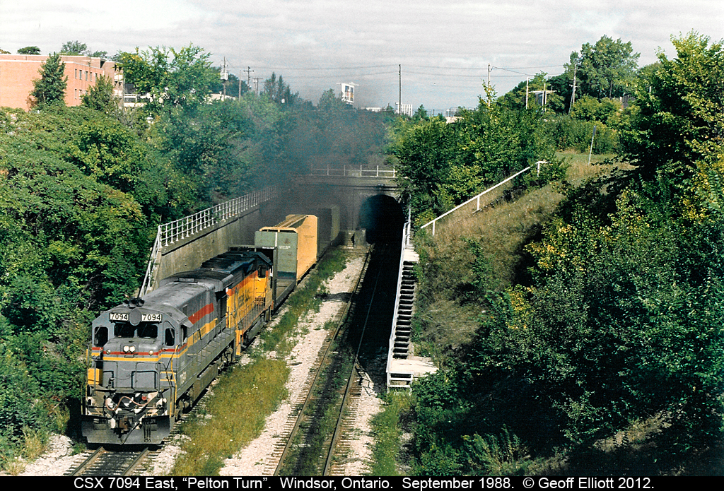 The CSX "Pelton Turn" roars out of the old Canada Southern railway tunnel after having passed under the Detroit river on it's way from Rougmere Yard in Dearborn, Michiga to Windsor, Ontario to interchange with CN and drop/lift cars for local CSX operations in Canada.