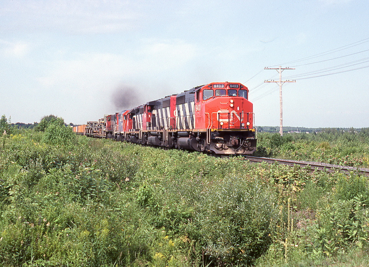 CN 310 accelerates after the curve through the village.