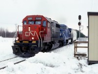 CN 312 with Ex UP 4098 leading and a leased LMS moving slowly towards the bridge.