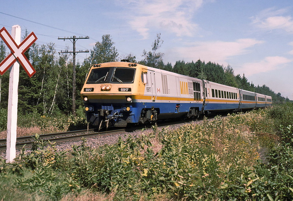 VIA 23,s horn is blaring for this unprotected dirt rd crossing.