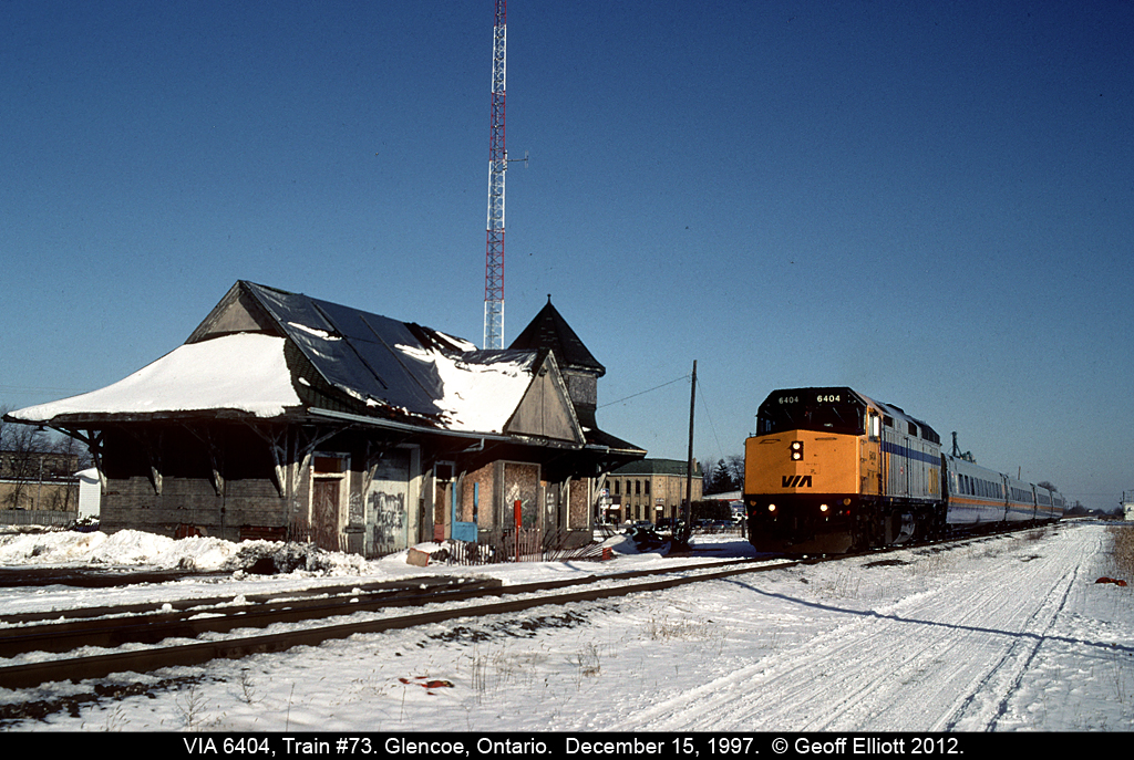 VIA #73, with F40PH-2 #6406, rolls past the old station @ Glencoe on December 17, 1997. As bad as this depot looks, I have to say they did an amazing job restoring it and making into a nice tourist attraction for the town.

See this photo for a comparison:  http://www.railpictures.ca/?attachment_id=2734