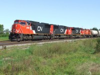 CN 401 rounds the curve at normal speed with its mix freight and now mixed power.