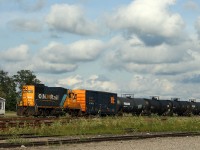 GP9 1602 sorting cars in Cochrane yard on a warm summer afternoon.