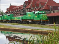 After dropping a cut of cars in the yard behind the impressive McAdam Station the power for 908 pulls ahead to rejoin their train on the main on the far side of the station, where they will wait an hour or so for trackwork up ahead to be completed before continuing on their journey from Vanceboro ME to St. John NB under the control of a new crew. Engineer Gilles and Conductor Chris spent the better part of that hour chatting it up with Wayne in the cab of 2318 while I wandered around trying to figure out just where in the heck he had disappeared to!