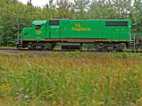 Pacing New Brunswick Southern 908 eastbound through the wetlands between St. Croix and McAdam.